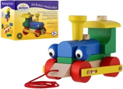 Detoa pomežikajoča vlečna lesena mašinca