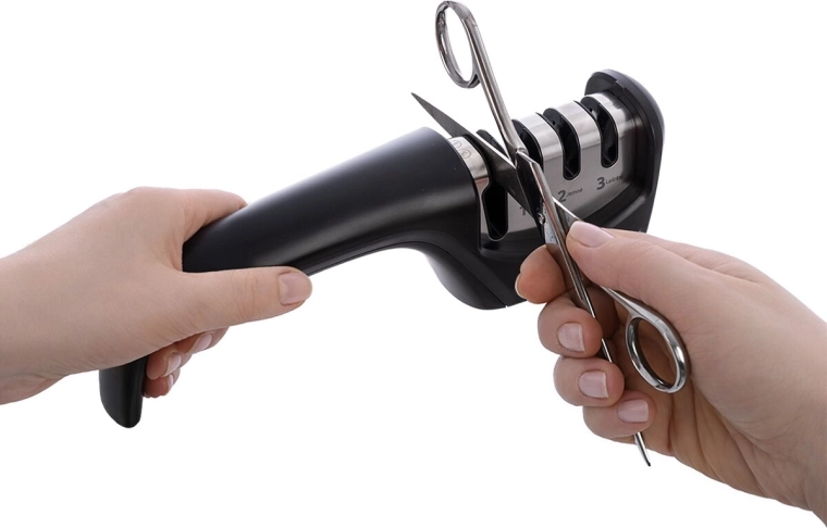 Slot for scissors and serrated edges