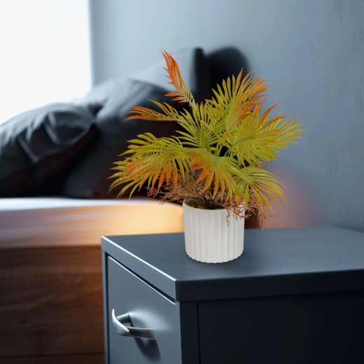 Decorative artificial palm in a flower pot