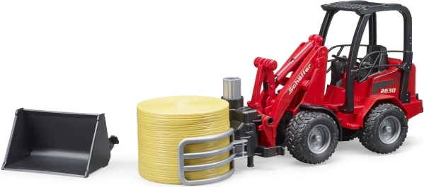 Čelni nakladač Schäffer s kleščami na pakete