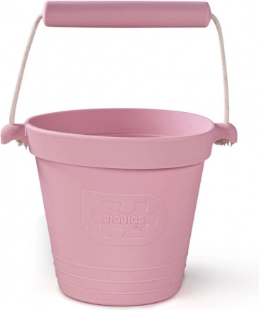 Silikonsko plažno vedro svetlo rožnato BIGJIGS TOYS