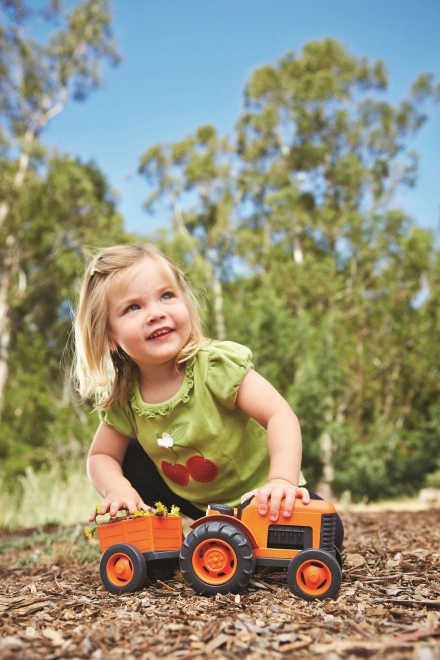 Traktor z vleko oranžen od Green Toys
