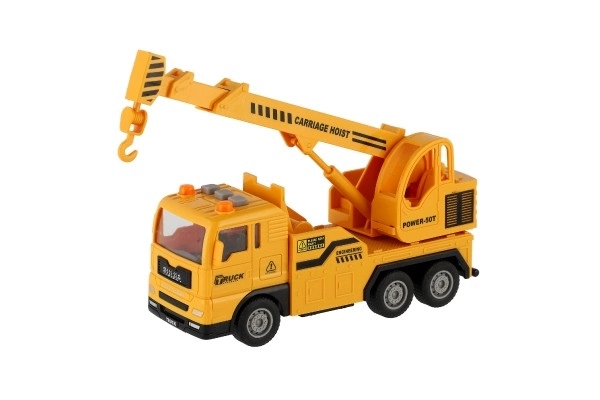 Plastični avto žerjav 16cm na vztrajnik na baterije z lučjo in zvokom v škatli 21x13x9cm