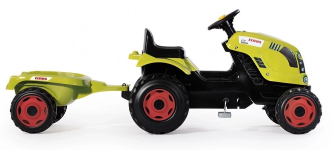 Pedalni traktor CLAAS Arion 400 z zelenim prikolidcem