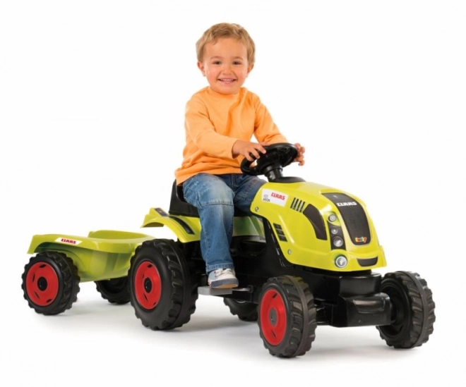 Pedalni traktor CLAAS Arion 400 z zelenim prikolidcem
