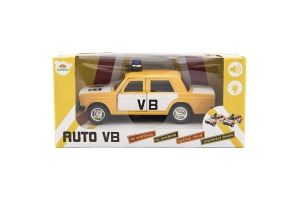 Policijski avto VB kovina/plastika 12cm na povratno vzmet na baterije s svetlobo, zvokom v škatli 15x7x7cm