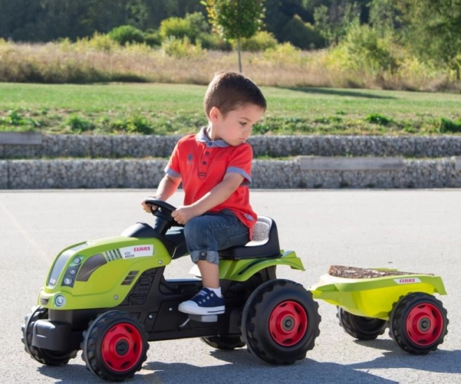 Pedalni traktor CLAAS Arion 400 z zelenim prikolidcem