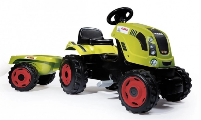 Pedalni traktor CLAAS Arion 400 z zelenim prikolidcem