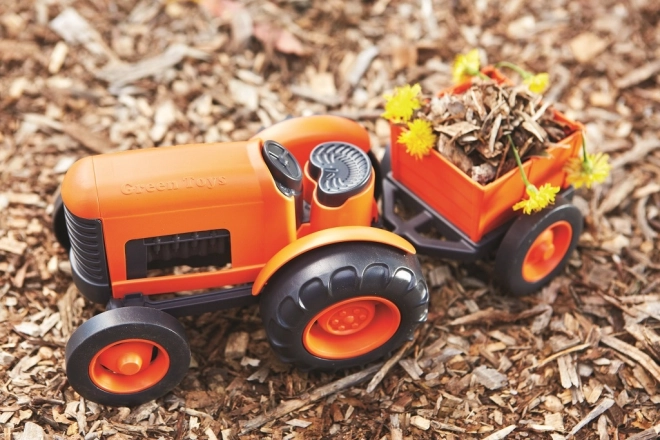 Traktor z vleko oranžen od Green Toys