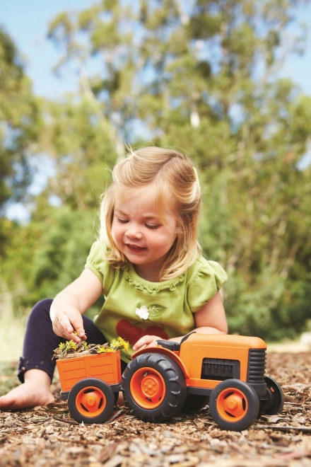 Traktor z vleko oranžen od Green Toys