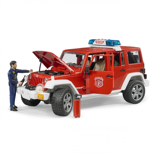 Bruder Rdeči gasilski JEEP WRANGLER s figurico in dodatki